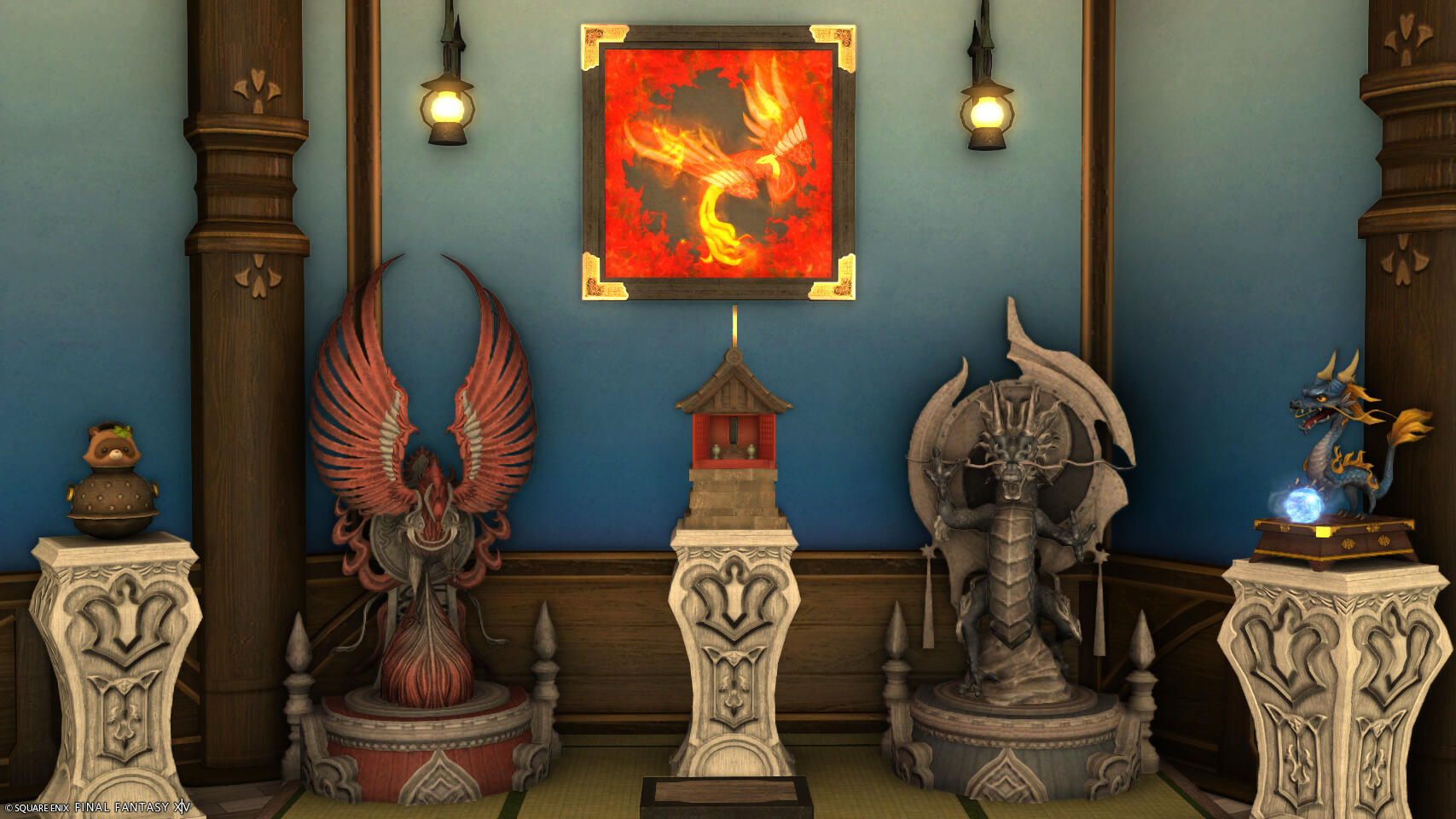 A screenshot from FFXIV of a museum display of five statues (a tanuki, large stone phoenix, a Japanese hokora, and two dragons, one large and one small) and a framed wall hanging of a phoenix on the wall above them.
