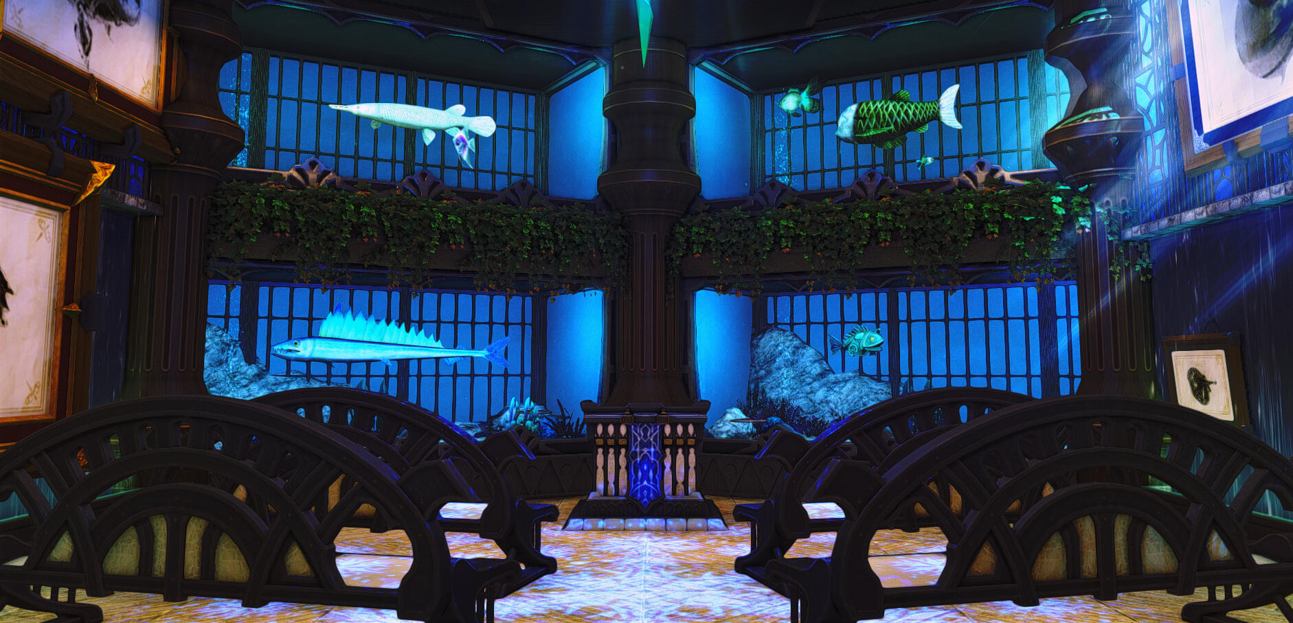 Room in the Big Fish House with aquarium fish in tanks and prints.